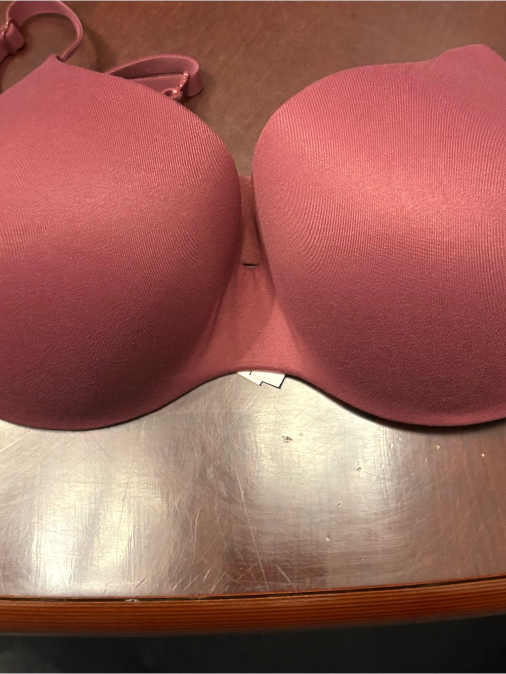 This Victoria Secret push-up bra. Features smooth panels and shoulder straps32DD